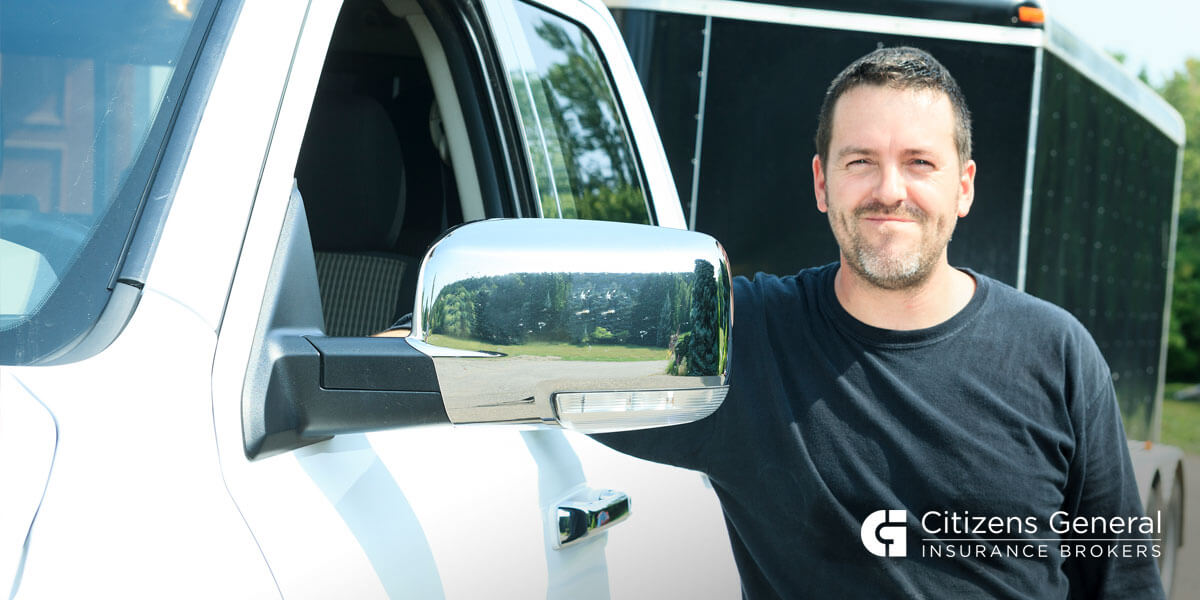 Smiling Man Standing By Truck